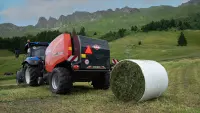 KUHN FB 3130 fixed round baler with film binding producing round bales in the mountains