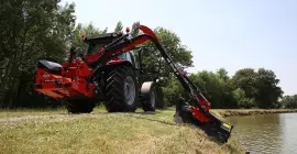 Преодоление препятствий машины для подрезки кустов и травы KUHN AGRI-LONGER GII с защитой рукояти, установленной на шарнирной опоре